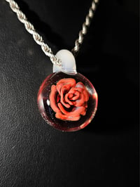 Image 4 of Uv reactive rose pendant with glow stick bale.