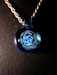 Image 2 of Uv reactive Blue rose pendant backed with blue stardust.