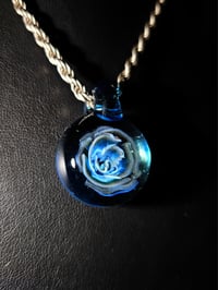 Image 5 of Uv reactive Blue rose pendant backed with blue stardust.