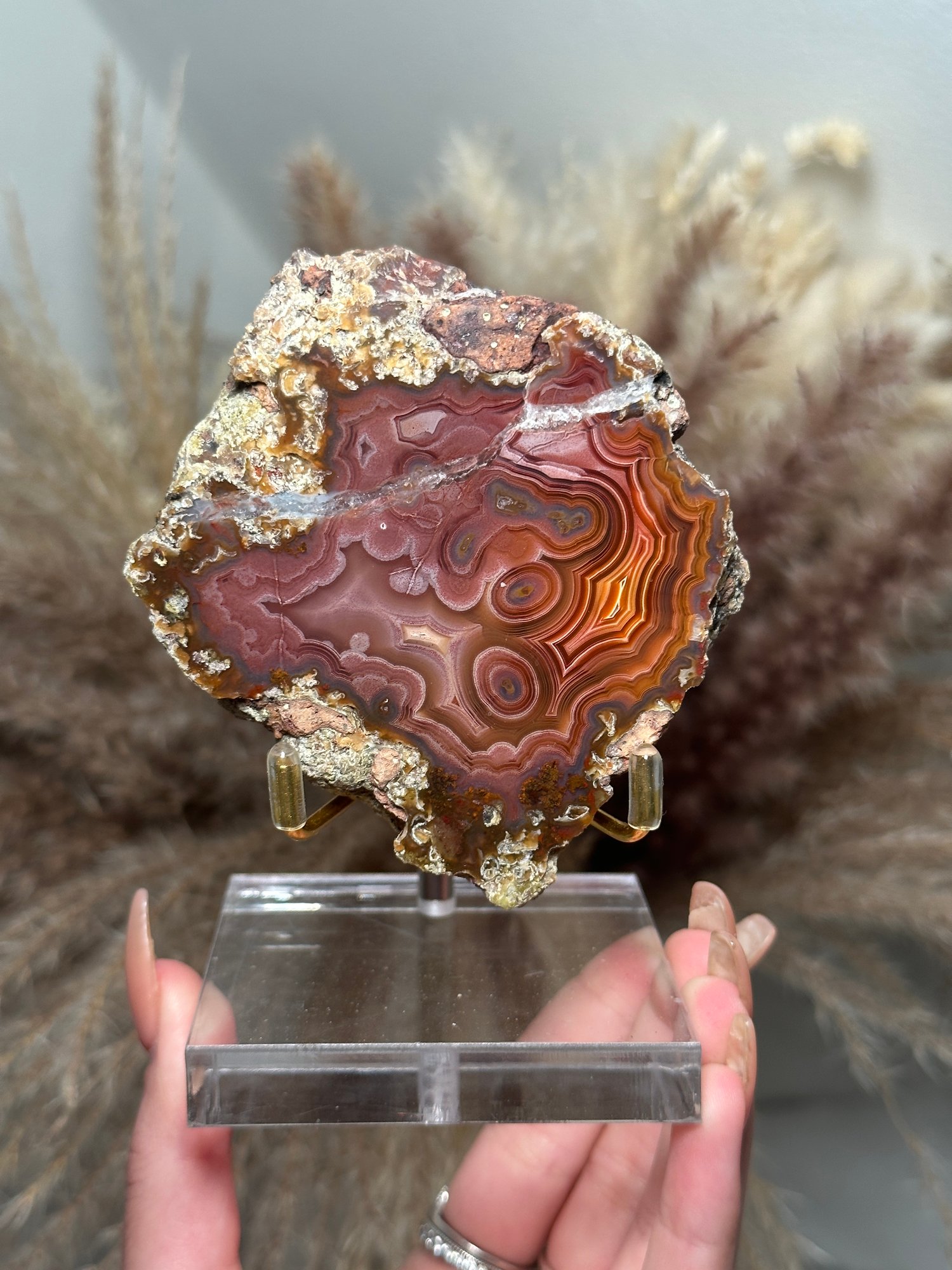 PINKY RED LAGUNA AGATE WITH PARALAX ON A STAND 