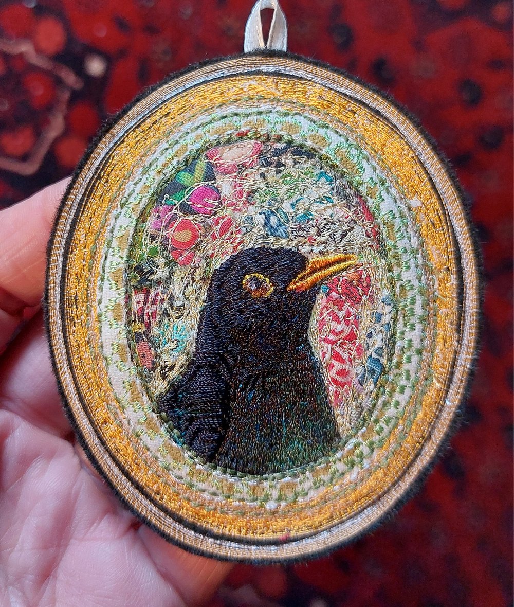 Image of Blackbird portrait miniature embroidery hanging 