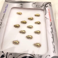Image 1 of Tear Drop Shape Bindis in Gold color.