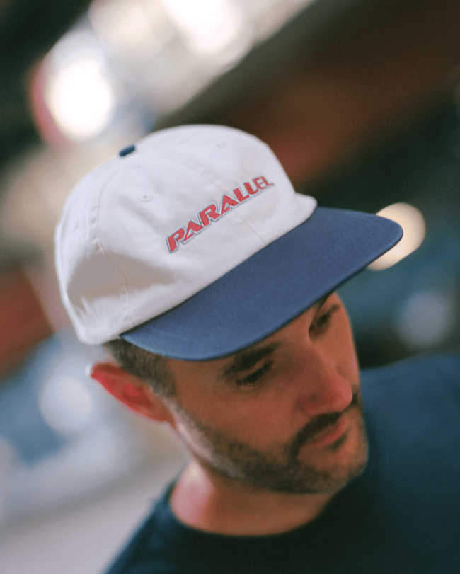 TEXT CAP // NAVY ECRU <p><del>$40.00</del> 