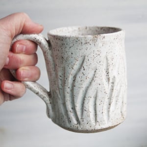 Image of Satin White Speckled Stoneware Mug, 12 Ounce, Hand Carved Floral Design, Made in USA
