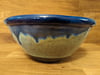 Blue stoneware bowl with sage and blue outer glaze.