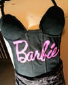 Black Corset with Pink Barbie Insignia on Front Shoulder Straps Grommet Closures