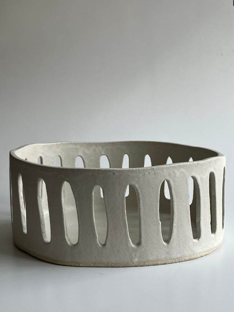 Image of large oval white stoneware basket