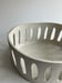 Image of large oval white stoneware basket