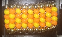 Image 1 of Orange and yellow cuff
