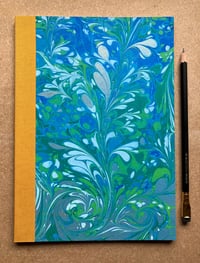 Image 1 of Sky Blue, Green & White Hand-Marbled Slim Lined Jotter- Imbolc/ Snowdrop Pattern
