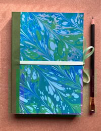 Image 1 of Sky Blue, Pale Blue & Green Hand-Marbled Large Plain Notebook- Imbolc/Snowdrop Pattern