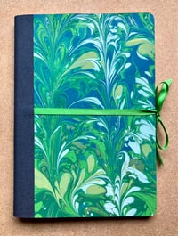 Image 1 of Blue, White & Green Hand-Marbled Thick Lined Notebook- Imbolc/ Snowdrop Pattern