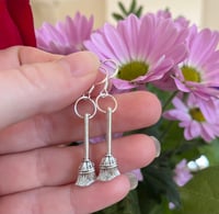 Silver broomstick charm earrings 