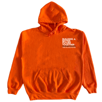 "Building A Better Future" The Black Hour in Orange Hoodie with Black & white