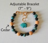 Image 1 of Turquoise, Magnetic Hematite, & Cedar Wood Bracelet (7"-9")