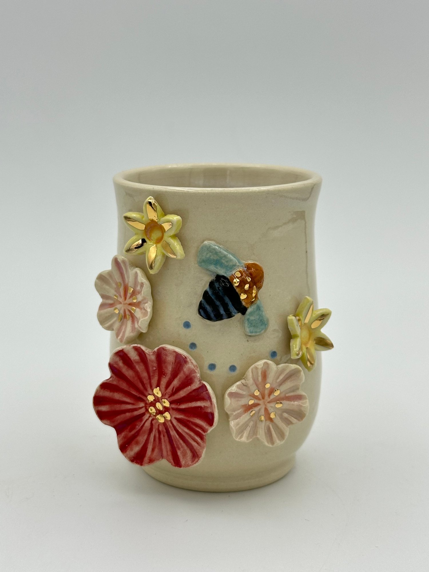 Image of Blue Banded Bee Vase (small) bee flying right