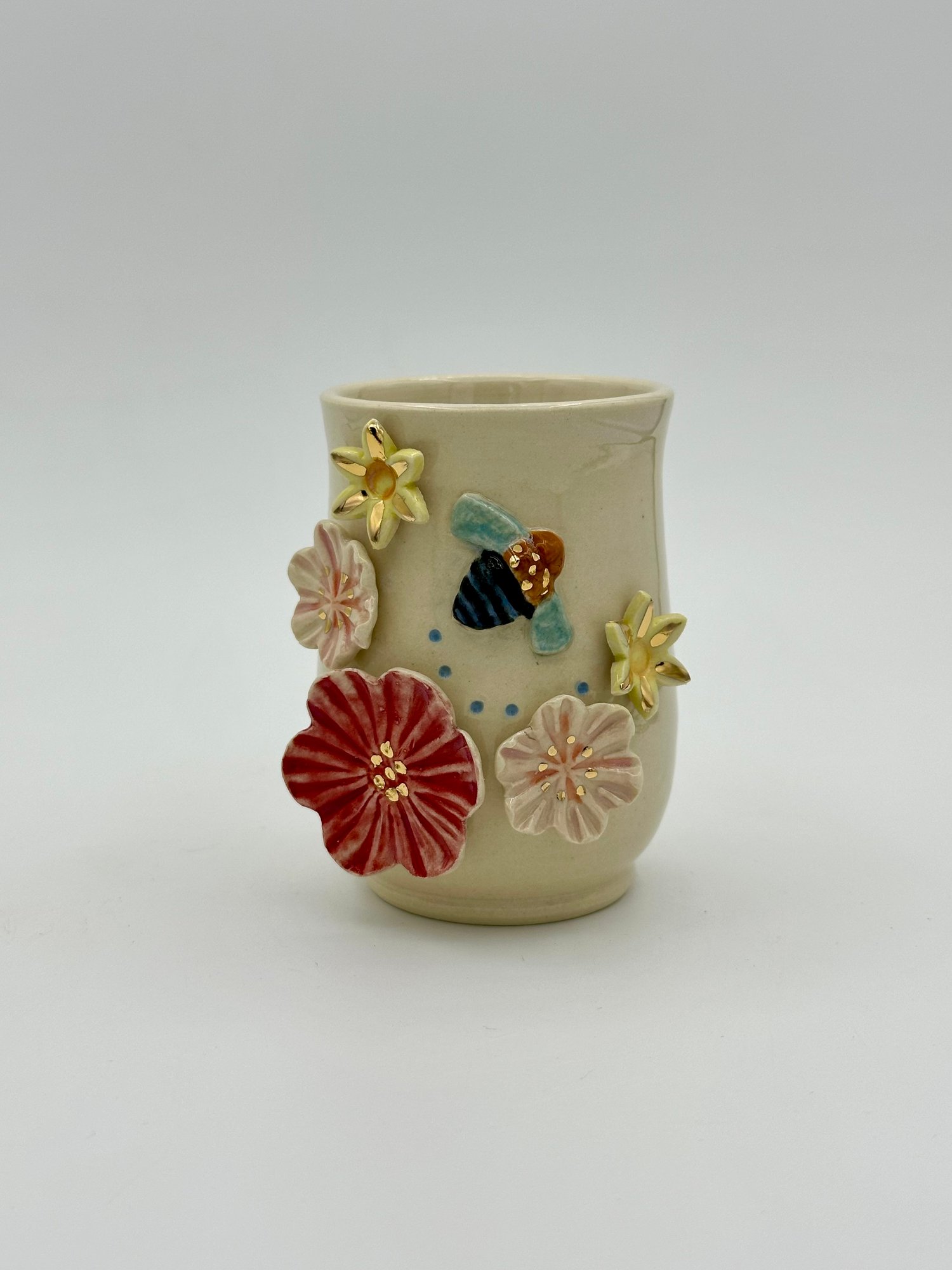 Image of Blue Banded Bee Vase (small) bee flying right