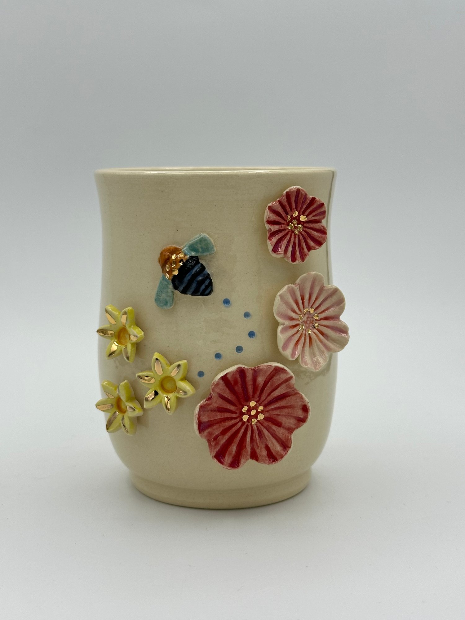 Image of Blue Banded Bee Vase (medium) bee flying left