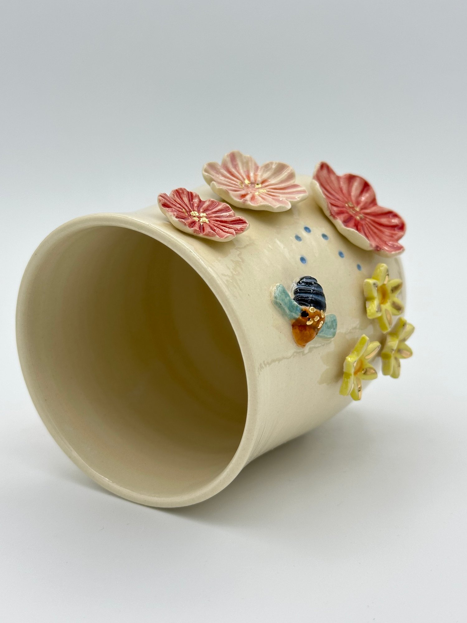 Image of Blue Banded Bee Vase (medium) bee flying left