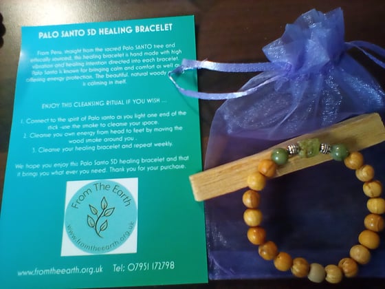 Image of Palo Santo bracelet with Peridot crystal and free palo santo smudge stick 