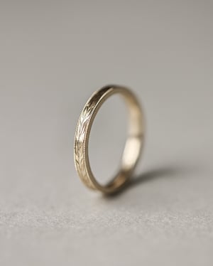 Image of 18ct Yellow gold, 2.5mm flat court Olive leaf and milled edge engraved ring