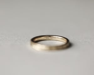 Image of 18ct Yellow gold, 2.5mm flat court Olive leaf and milled edge engraved ring