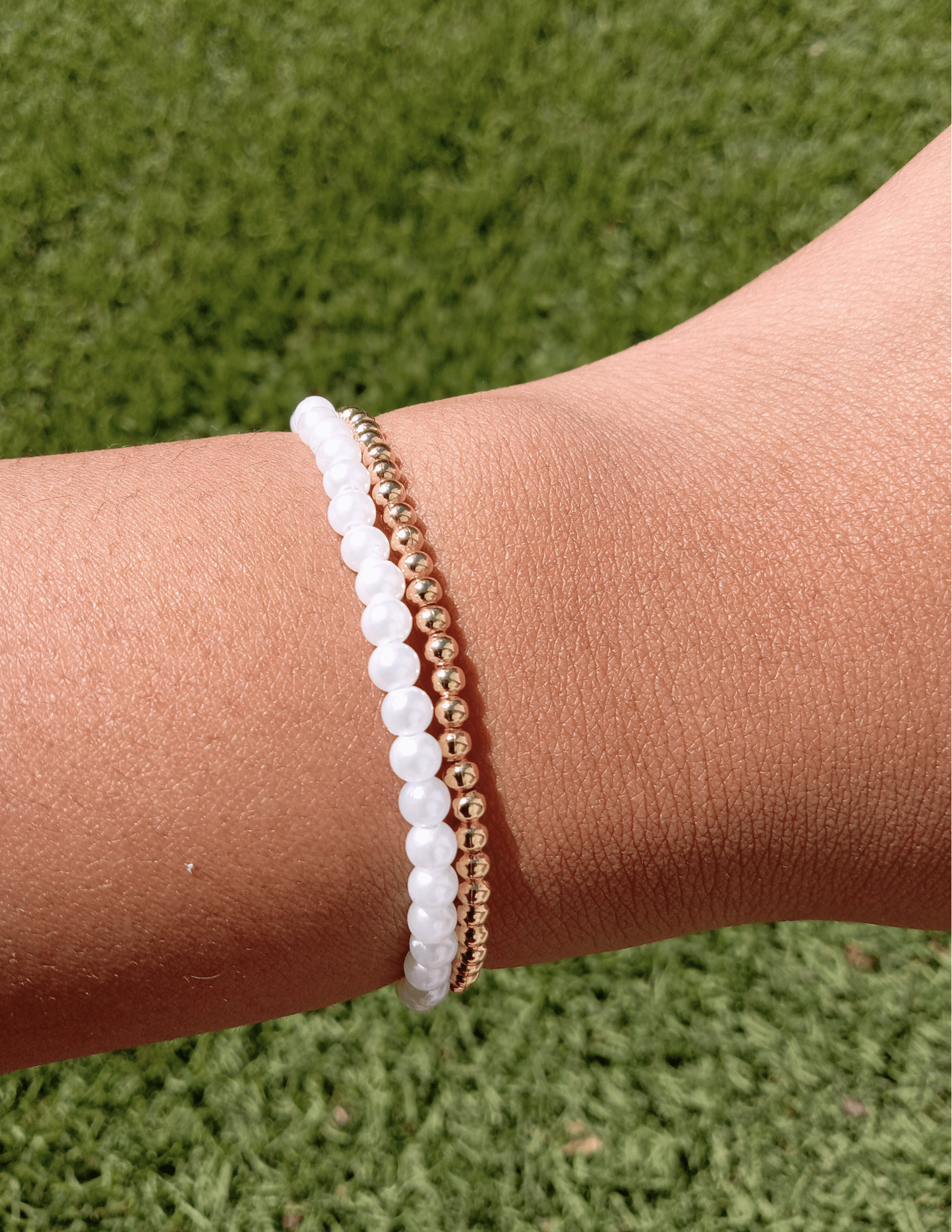 Image of gold and pearls bracelet stack