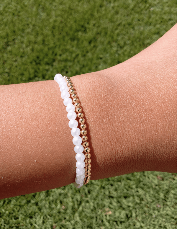Image of gold and pearls bracelet stack