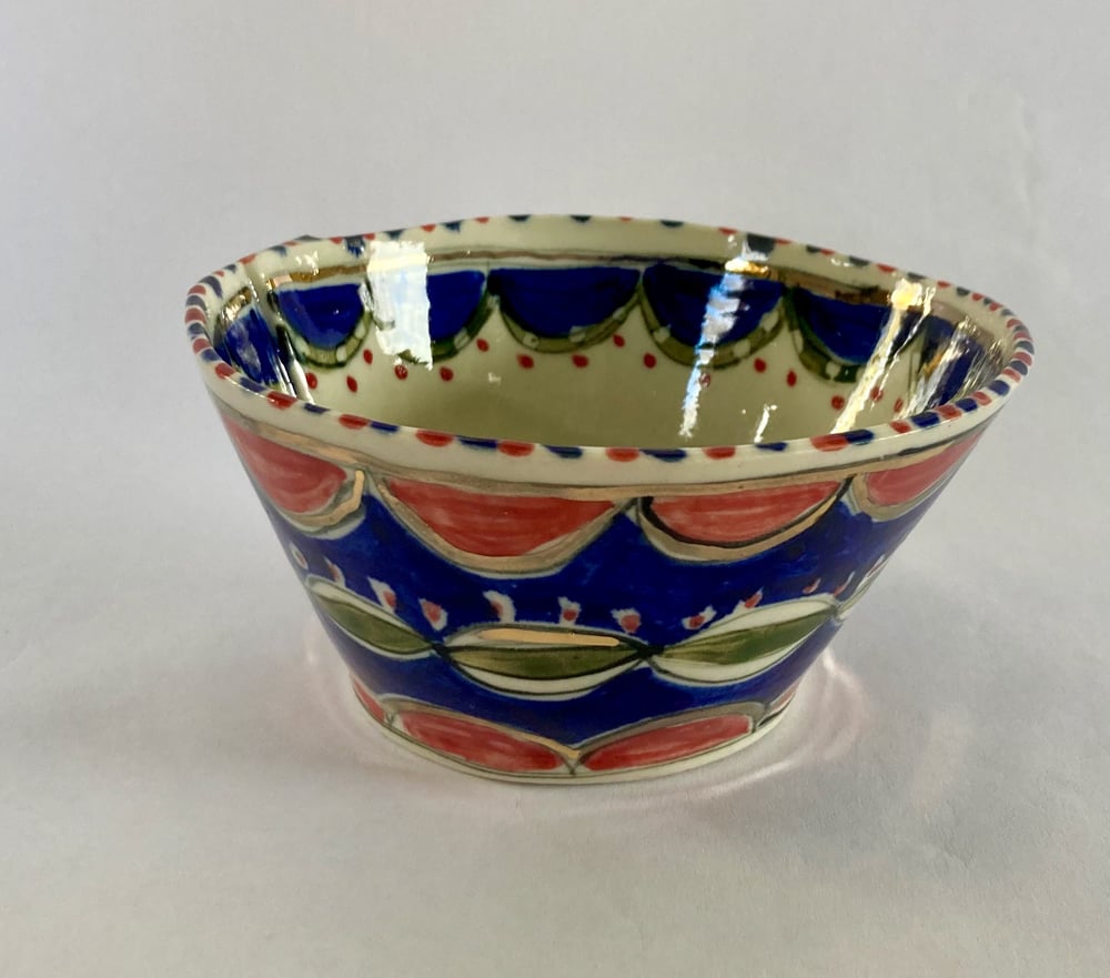 Image of Two small bowls  blue and orange with gold