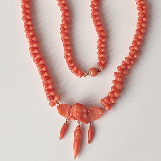 Image of ANTIQUE CORAL CUPID NECKLACE