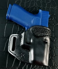 Image 1 of Glock 43x Blacked out pancake holster with hand tooling.