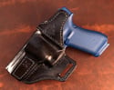 Glock G17 Blacked out avenger style holster.