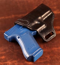 Image 3 of Glock G17 Blacked out avenger style holster.