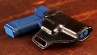 Image 4 of Glock G17 Blacked out avenger style holster.
