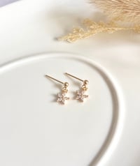 Image 3 of Tiny Star Flower stud Earrings