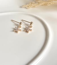 Image 4 of Tiny Star Flower stud Earrings