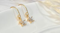 Image 3 of Tiny Star Flower Earrings