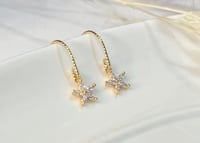Image 4 of Tiny Star Flower Earrings