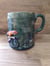 Image of Cycling mug with hills and a badger