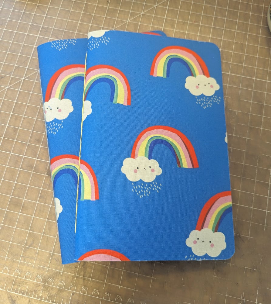 Image of Happy Rainbows Caheir-Style Notebook