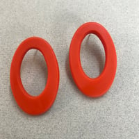 Image 1 of bright orange oval hoops