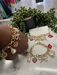 Image 1 of Gold bow charmbracelet 