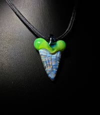 Image 2 of CFL reactive mixed color shark tooth pendant with green slyme top and blue stardust bale.