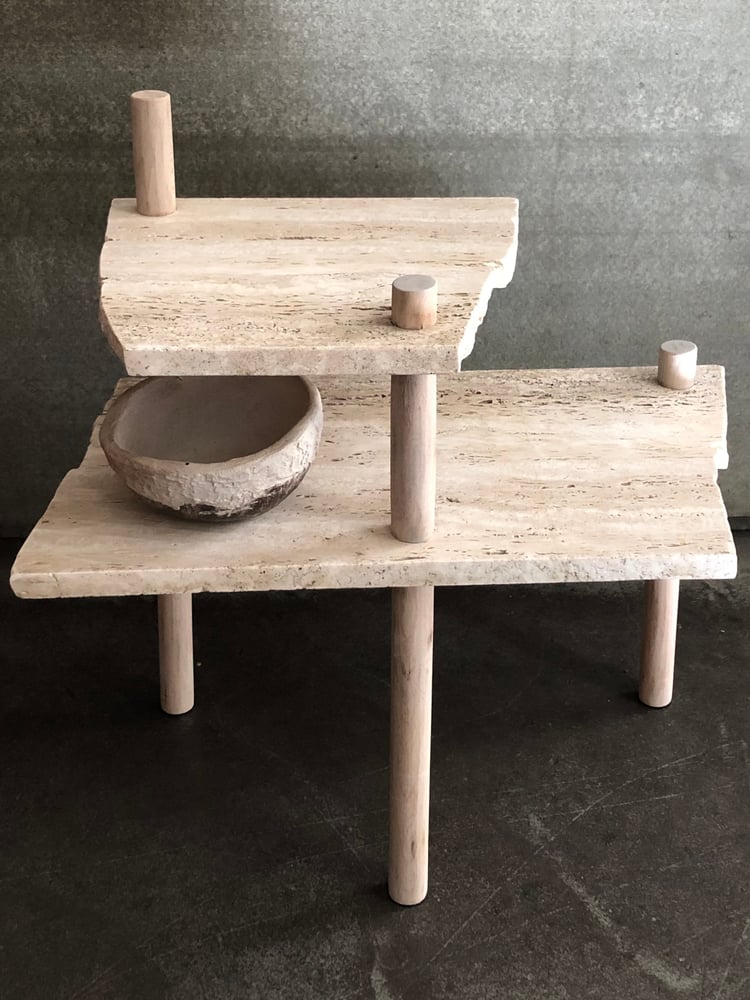 Image of broken travertine table