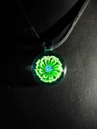 Image 5 of UV reactive glow flower pendant backed in blue stardust 💎🟢🌻