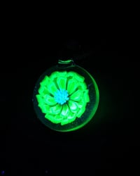 Image 3 of UV reactive glow flower pendant backed in blue stardust 💎🟢🌻