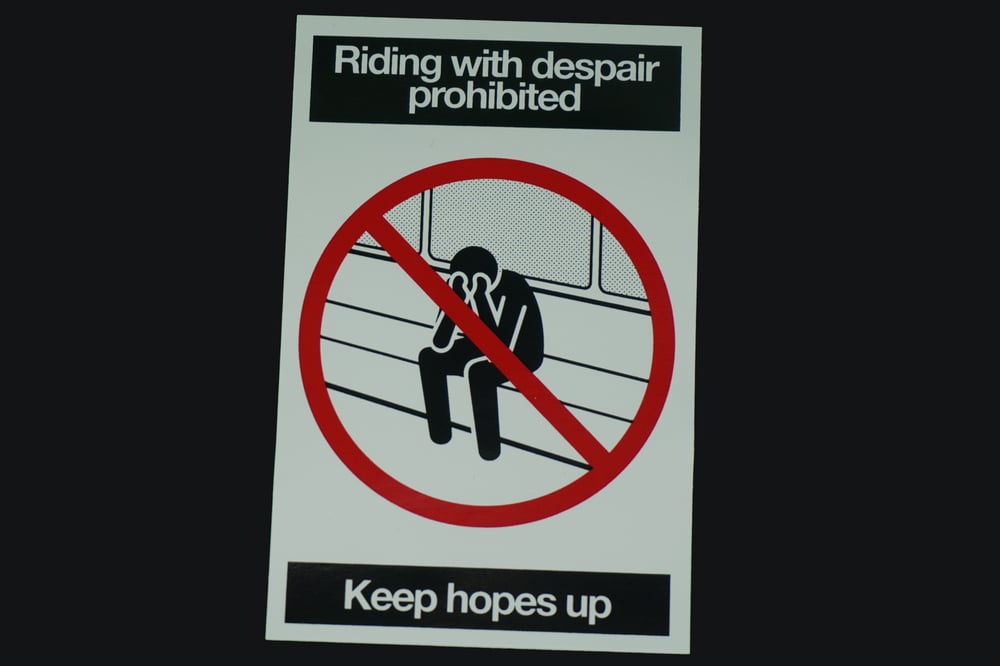 "Riding With Despair Prohibited Keep Hopes Up" Sticker