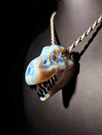 Image 1 of Mirage (CFL) T-Rex skull pendant Ruth galaxy teeth.