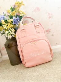 Image 1 of Pretty pink changing bag