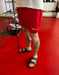 Image of RED NLP SHORTS / WHITE FOIL PRINT